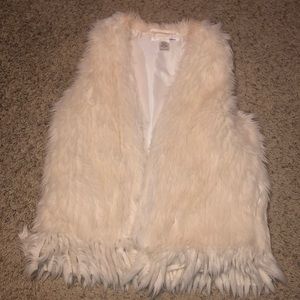 White fur vest